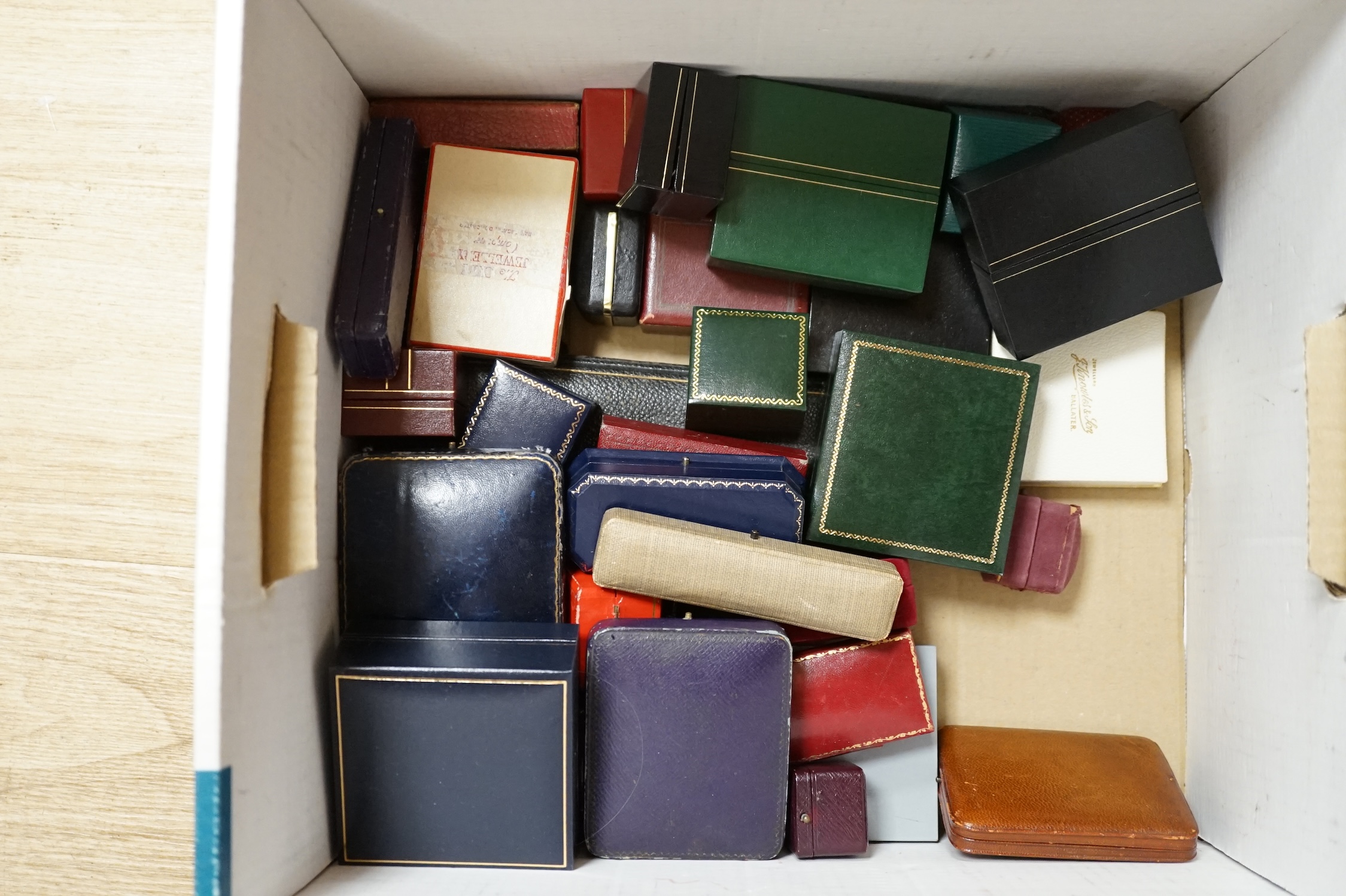 A quantity of assorted jewellery boxes, including Cartier, Must de Cartier and T. Kishanchand. Condition - poor to fair to good